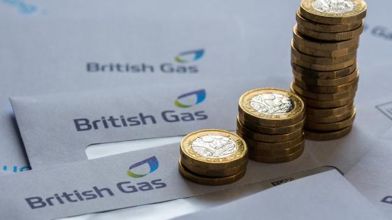 Stacks of One Pound coins on top of British Gas bills
