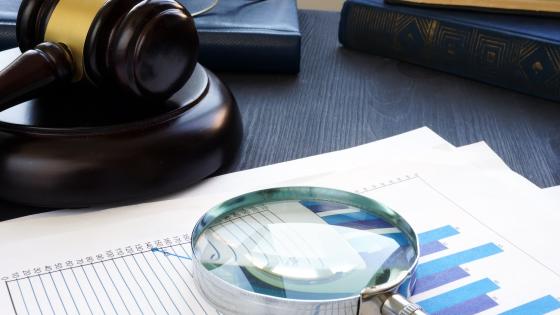 Magnifying glass, chart and gavel